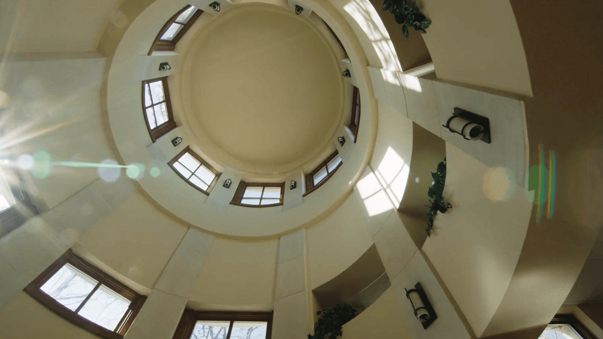 Sunlight entering a circular atrium through tall windows